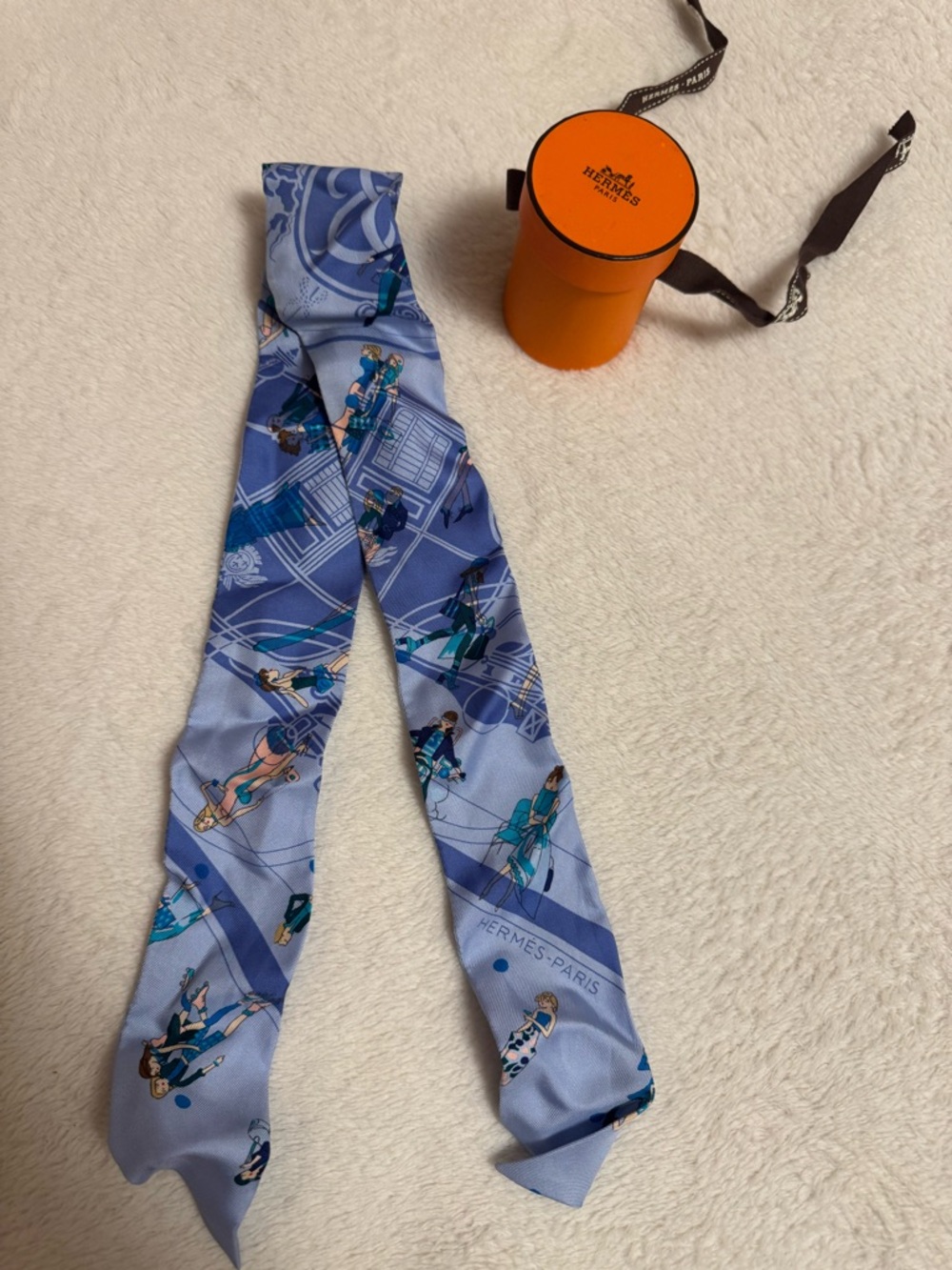 Hermès light blue and teal silk twilly with navy figures